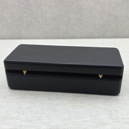 Closed black ash wood presentation box back view showing durable brass hinges