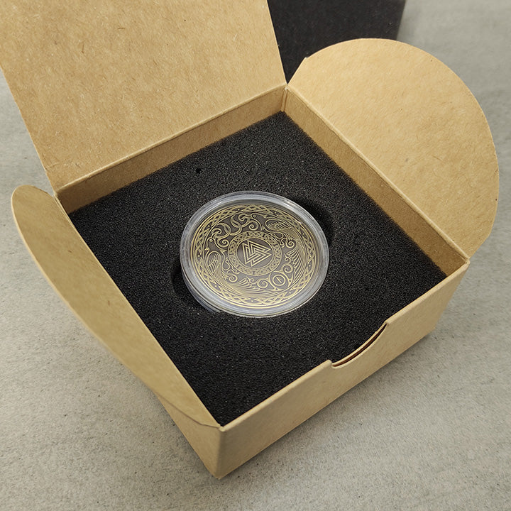 Handcrafted Valknut brass coin in a protective acrylic capsule and craft gift box, premium presentation of a Norse gift.