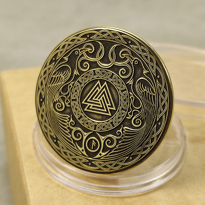 Top view of a Norse Valknut amulet coin in brass, detailed Scandinavian knotwork engraving with high-contrast finish.
