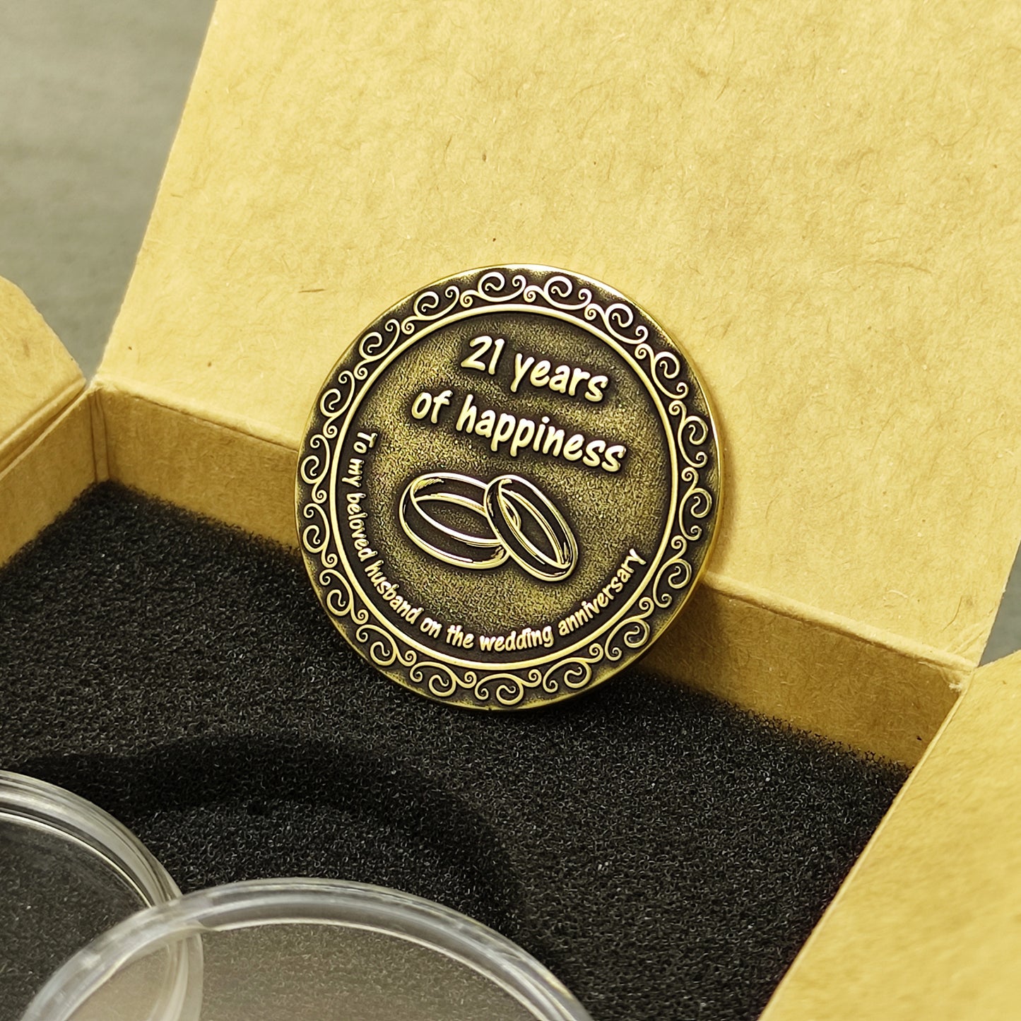 Handmade brass anniversary souvenir coin for husband placed in a stylish gift box with black foam insert, 21st wedding anniversary gift.
