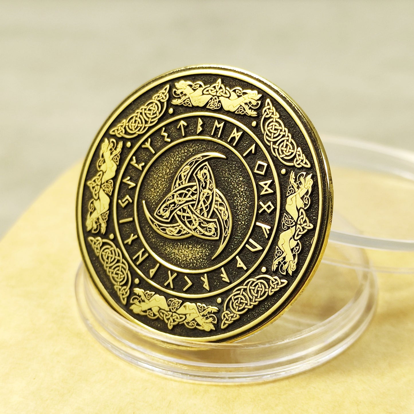 Custom brass coin with Odin's Triple Horn symbol and Elder Futhark runes, 32mm diameter, deep laser engraving with black patina finish.