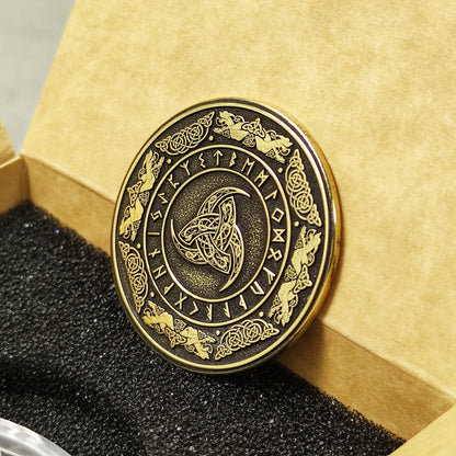 Perspective view of a 2mm thick brass challenge coin in a gift box, showcasing the metallic luster and detailed Viking symbolism.