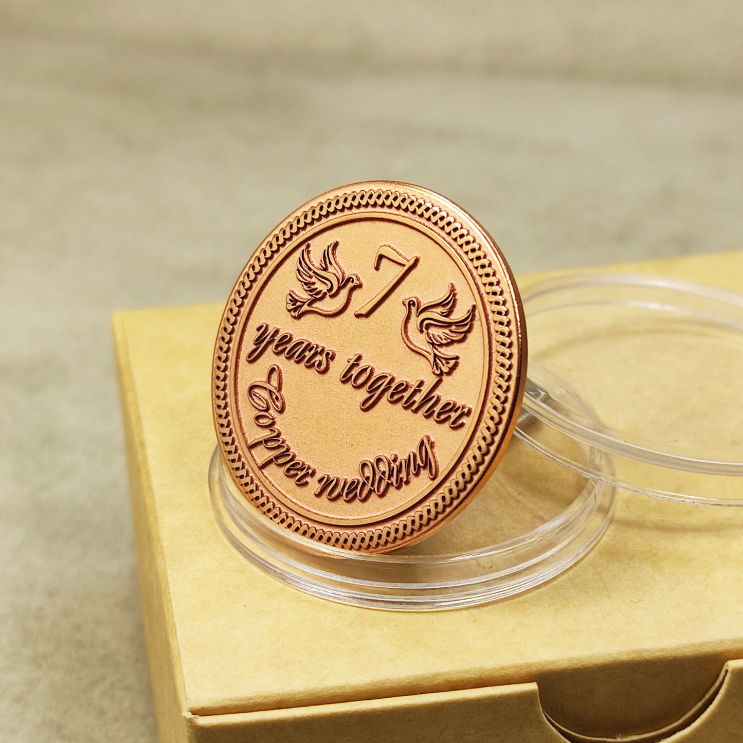 Pure copper 7th anniversary souvenir coin, personalized romantic gift with decorative border and glossy polished surface, obverse view.