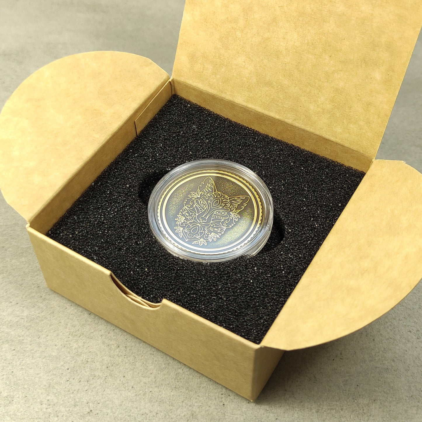 Brass collector coin in a premium gift box packaging with black foam insert, perfect for a personalized anniversary present.