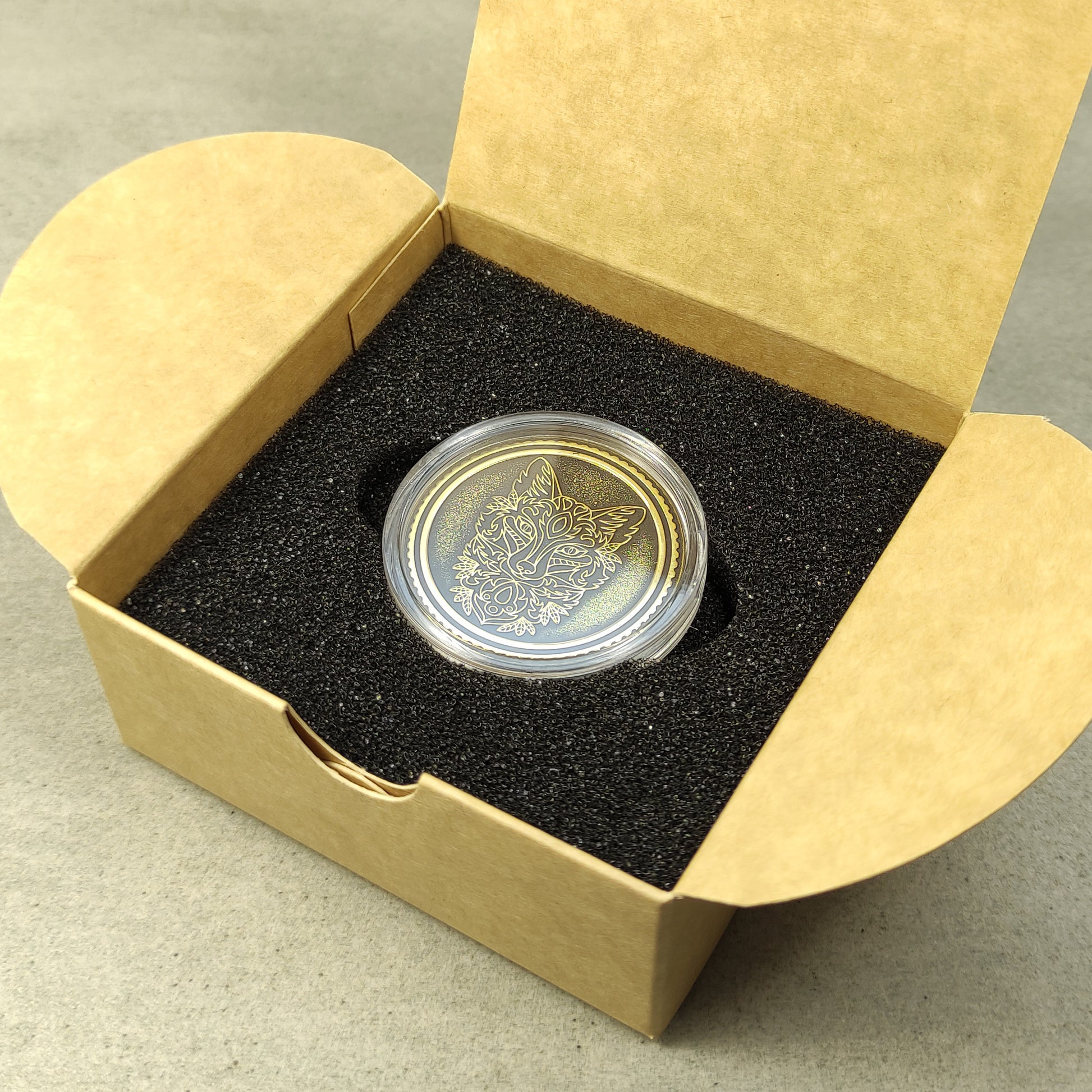 Brass collector coin in a premium gift box packaging with black foam insert, perfect for a personalized anniversary present.