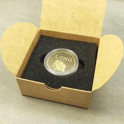 Personalized brass mammoth coin presented in an elegant cardboard gift box with black foam insert.