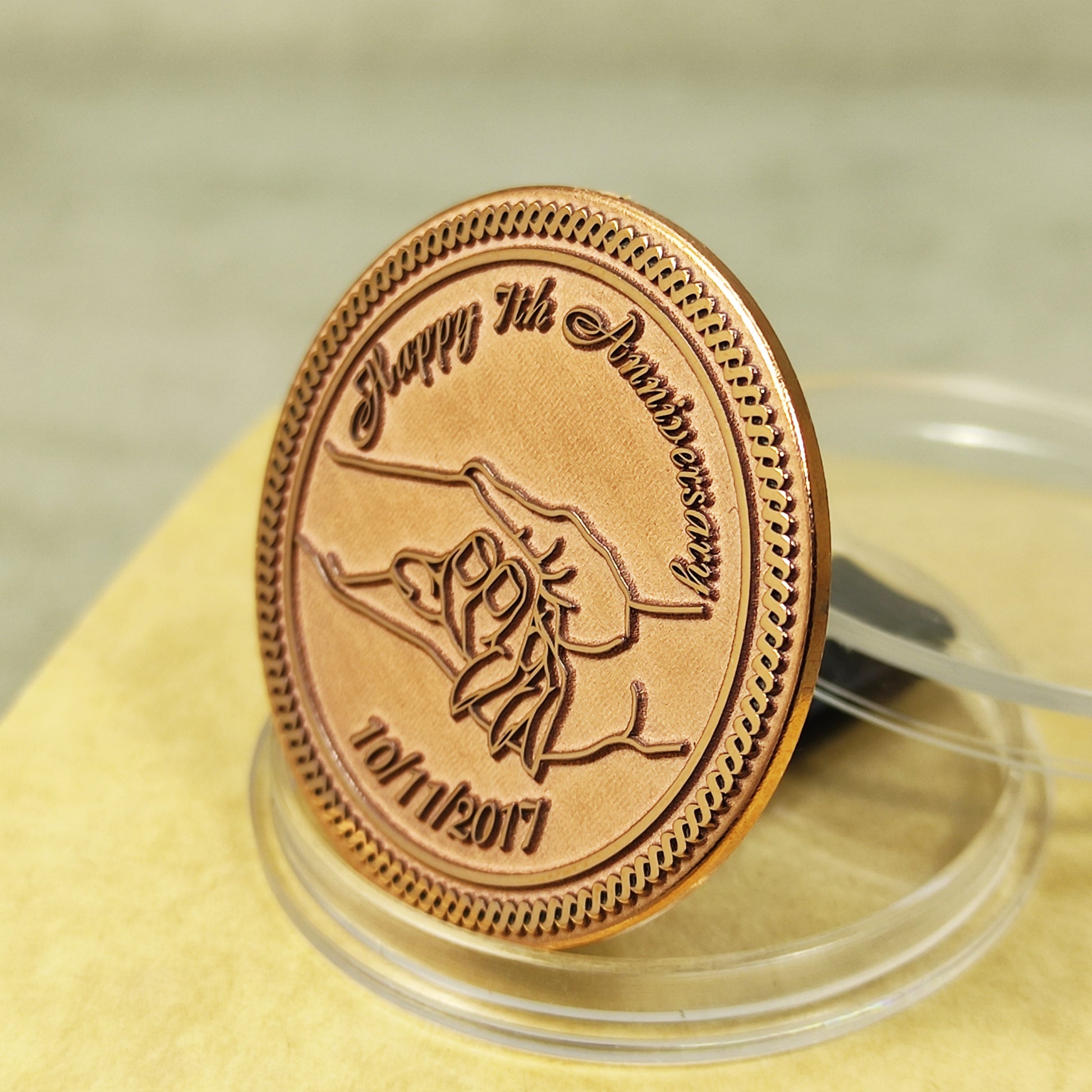 Pure copper 7th anniversary souvenir coin, personalized romantic gift with decorative border and glossy polished surface, obverse view.