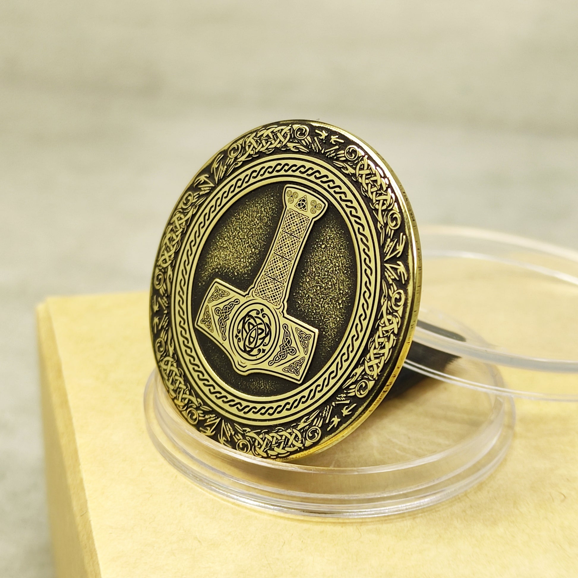 Angled view of 32mm solid brass Viking coin showing the thickness and relief depth.