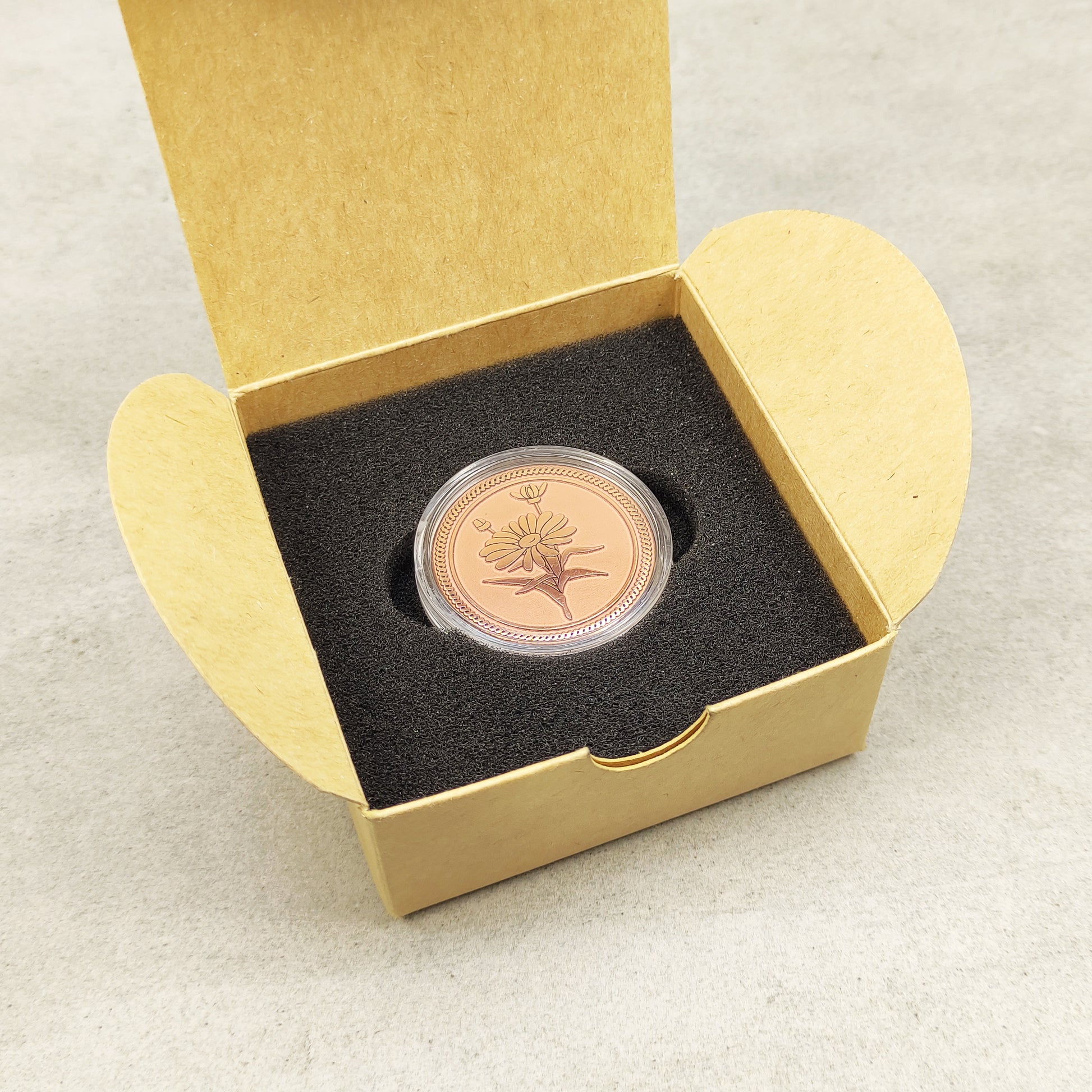 Aesthetic presentation of the copper flower medal in a craft box, ideal for a 7th wedding anniversary gift or personalized keepsake.