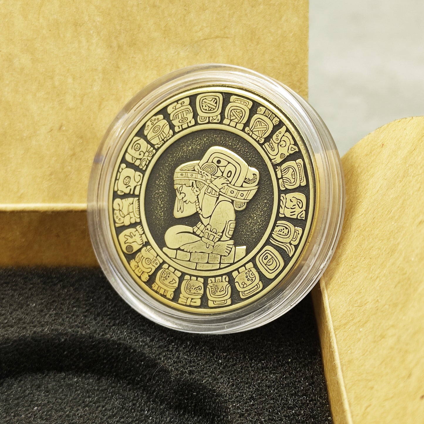Handcrafted Mayan brass amulet in a protective capsule and craft gift box, unique personalized historical souvenir.