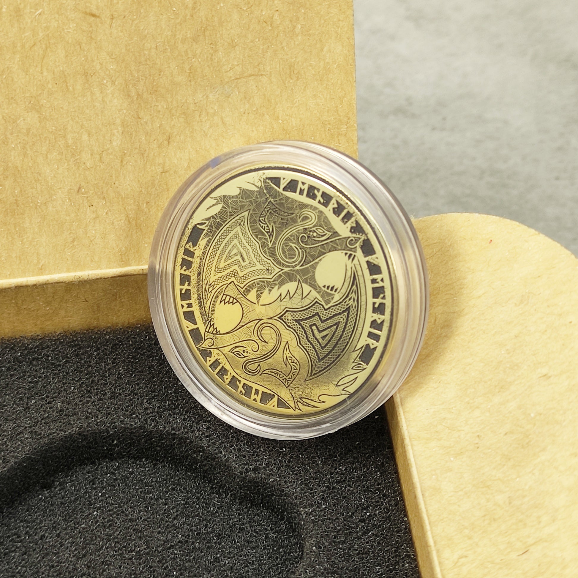 Handmade Viking wolf brass coin in a craft gift box with black insert, unique personalized gift for Norse mythology lovers.