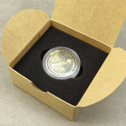 Personalized Fenrir brass coin in a protective acrylic capsule and craft box, premium presentation of a handcrafted Viking gift.