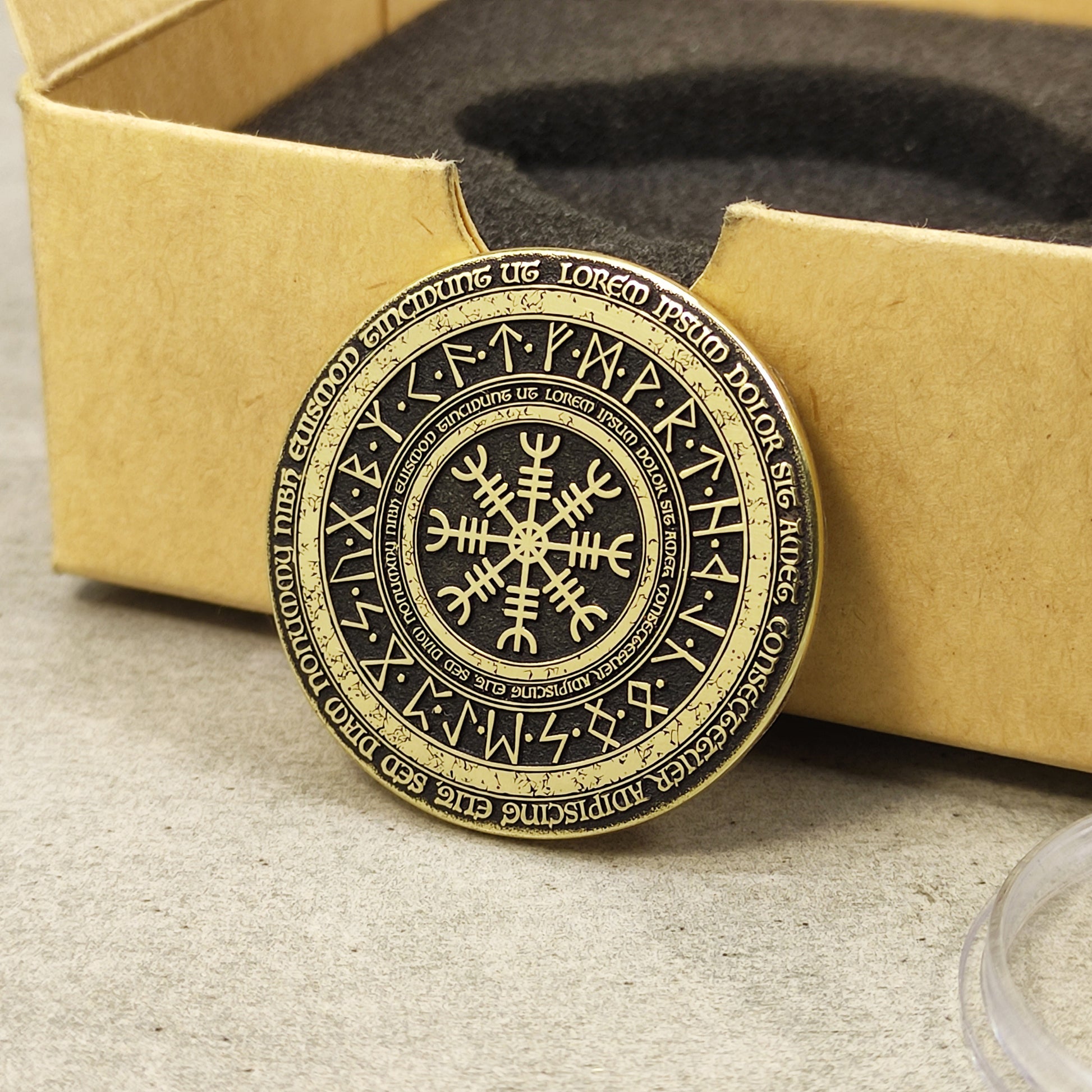 Brass Viking compass amulet with runic circle, handcrafted metal coin with aged patina finish.