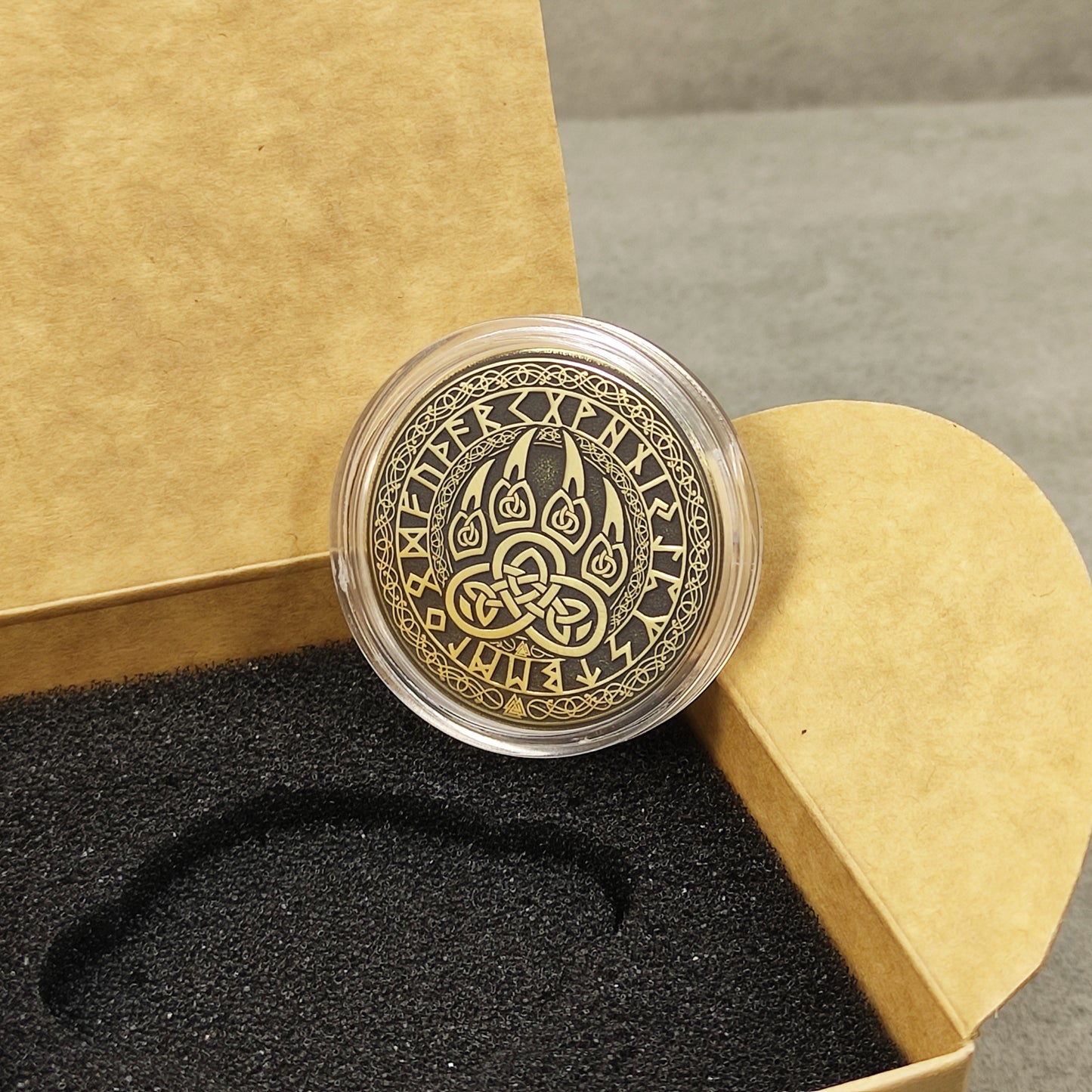 Bear paw brass amulet in a protective acrylic capsule and eco-friendly craft gift box.