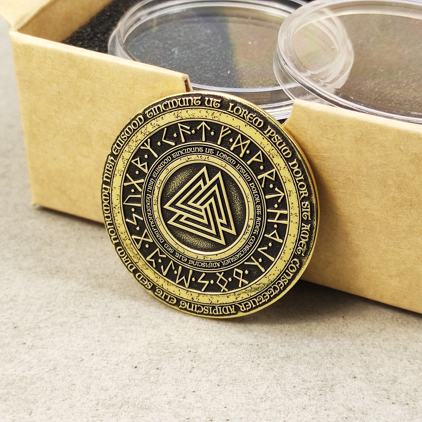 Side perspective of a 2mm thick brass challenge coin, showcasing the metallic texture and precision of the Valknut design.