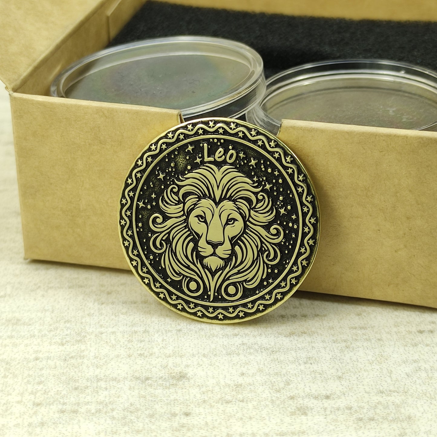 Leo zodiac brass medal presented with minimalist gift packaging, showcasing the 32mm diameter and premium metal quality of the custom engraved coin.