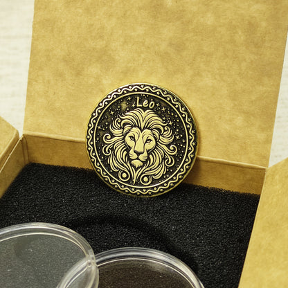 Custom Leo zodiac brass coin in a premium gift box with black foam insert, highlighting the gold-tone brass material and dark engraved details.