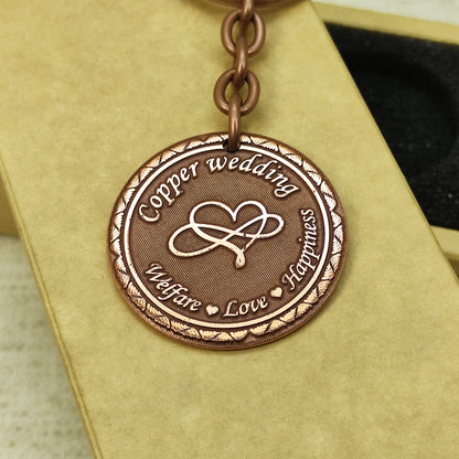 Detailed view of 7th anniversary copper medallion showing deep laser etching and professional dark patina.
