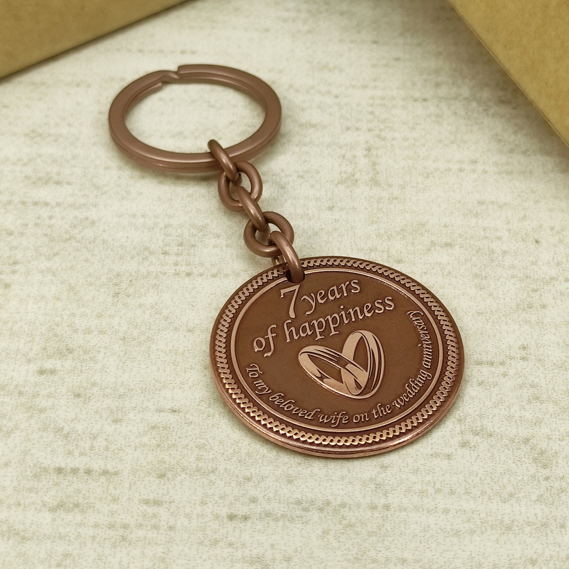 Hand-polished copper anniversary keychain with "To my beloved wife" text, personalized wedding date engraving, high-quality metalwork.