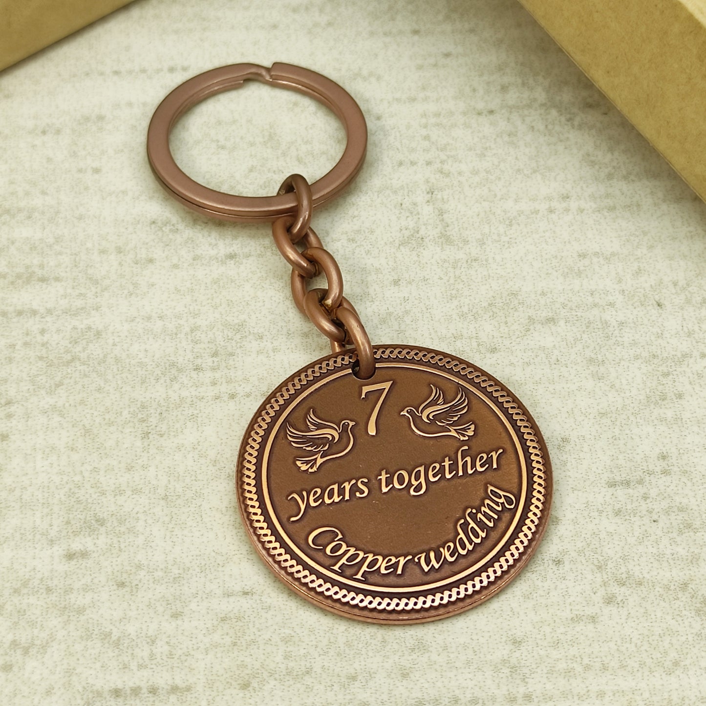 Custom engraved copper wedding anniversary keychain for men and women with durable metal ring.
