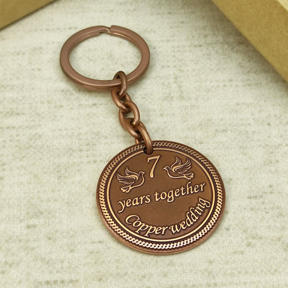 Custom engraved copper wedding anniversary keychain for men and women with durable metal ring.