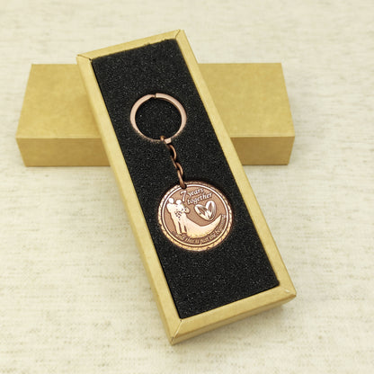 Personalized 7th anniversary copper keychain inside a premium gift box, ready to gift handmade souvenir with custom engraving.