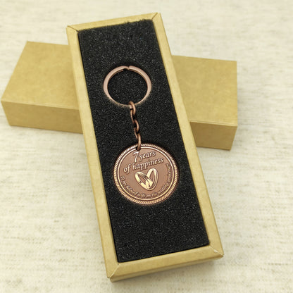 Personalized 7th anniversary copper keychain for wife inside a premium gift box, ready to gift handmade souvenir with custom engraving.