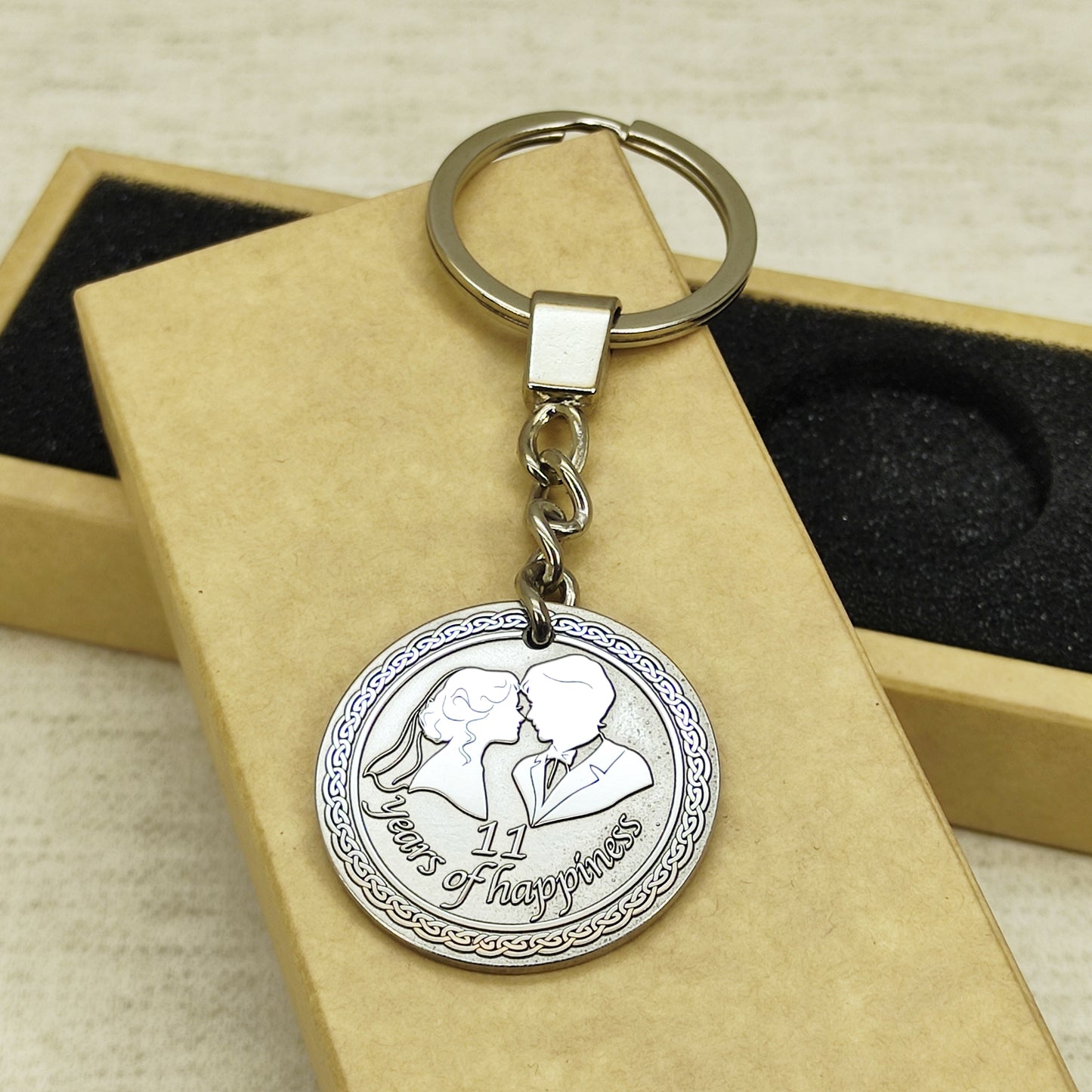 Side view of the personalized stainless steel anniversary coin keychain, showcasing the thickness and premium metal quality of the 11-year wedding gift.