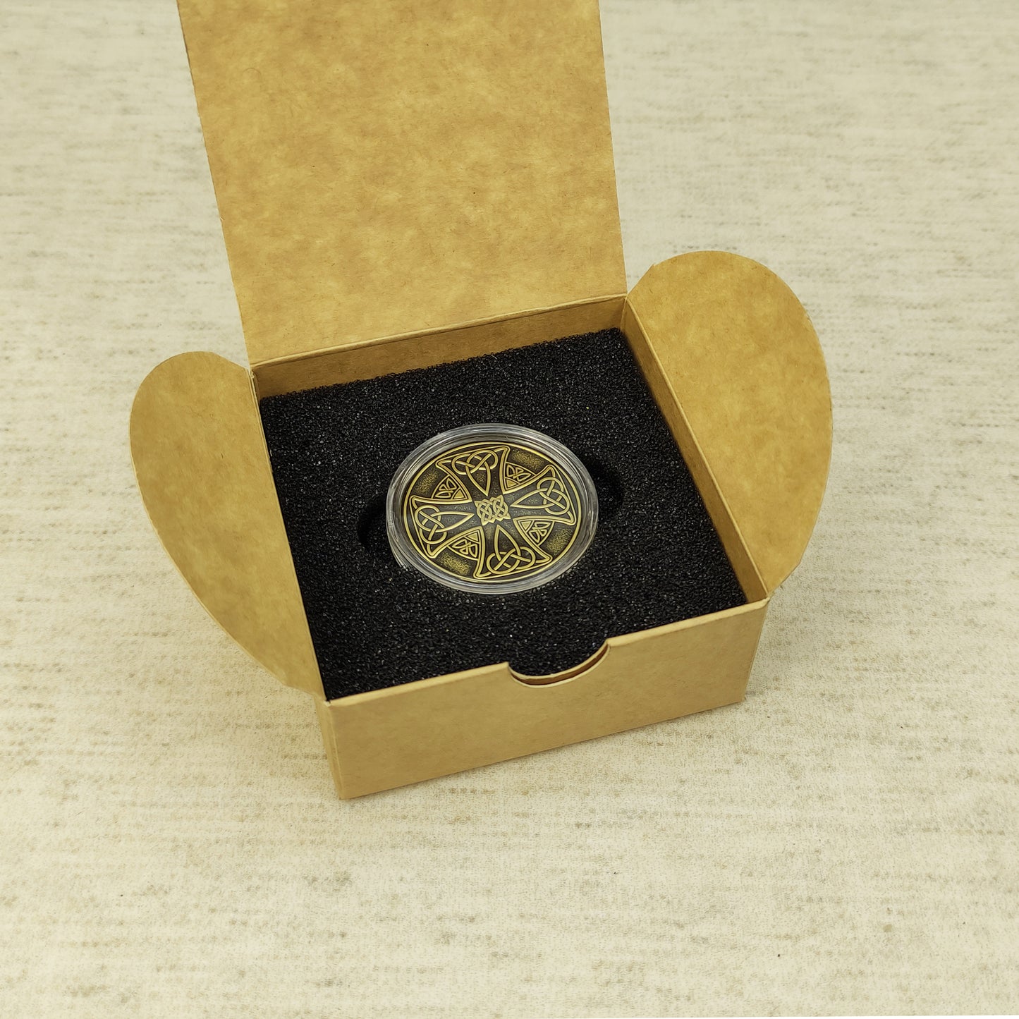 Personalized Celtic brass coin in a protective acrylic capsule and gift box, ready-to-gift handcrafted souvenir.