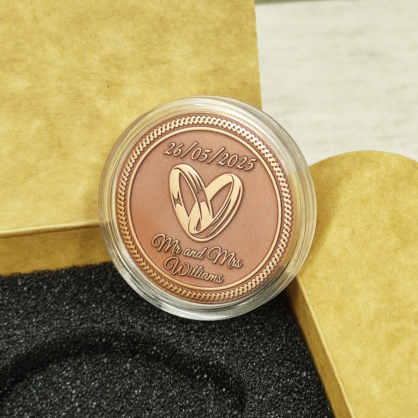 Macro photo of a custom copper anniversary token in a clear protective capsule, ensuring the preservation of the matte copper patina.