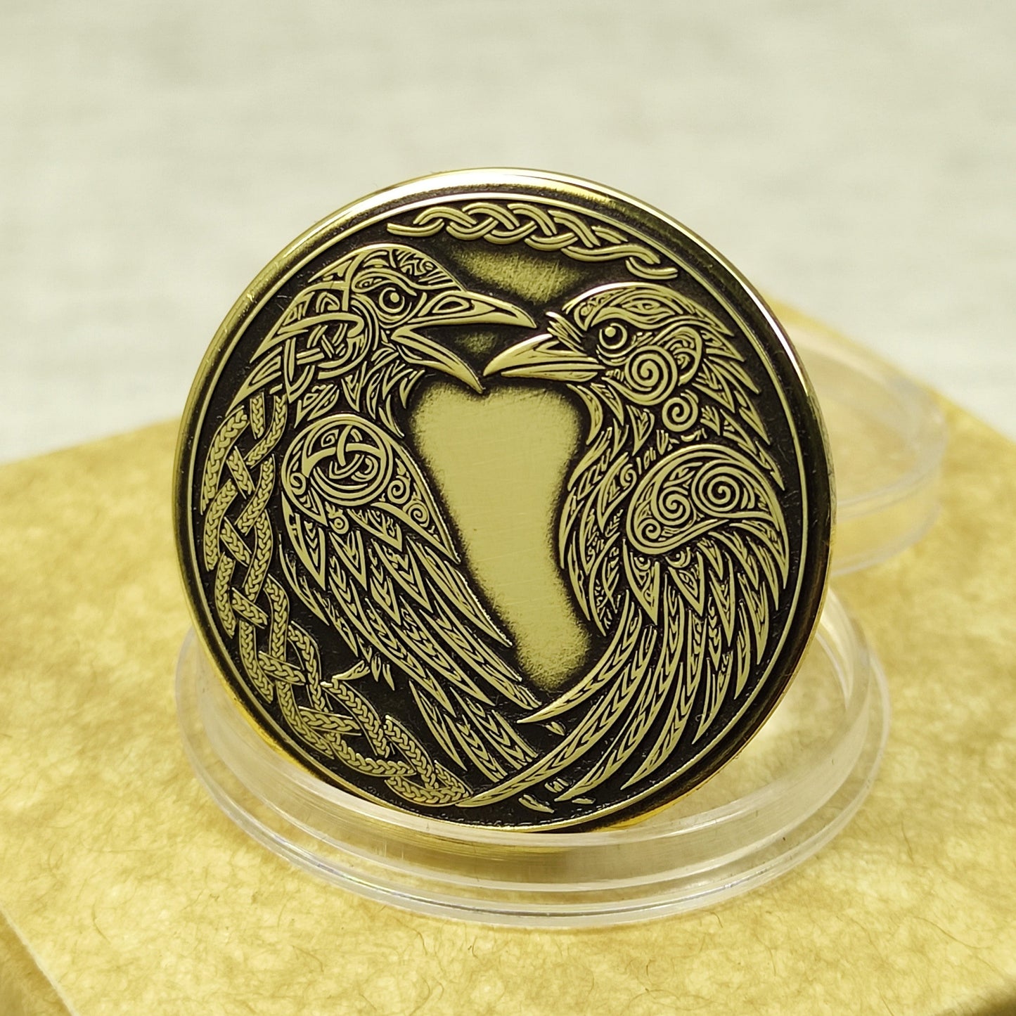Handmade brass coin with Odin's ravens Huginn and Muninn, deep laser engraved Norse mythology amulet, black patina finish.