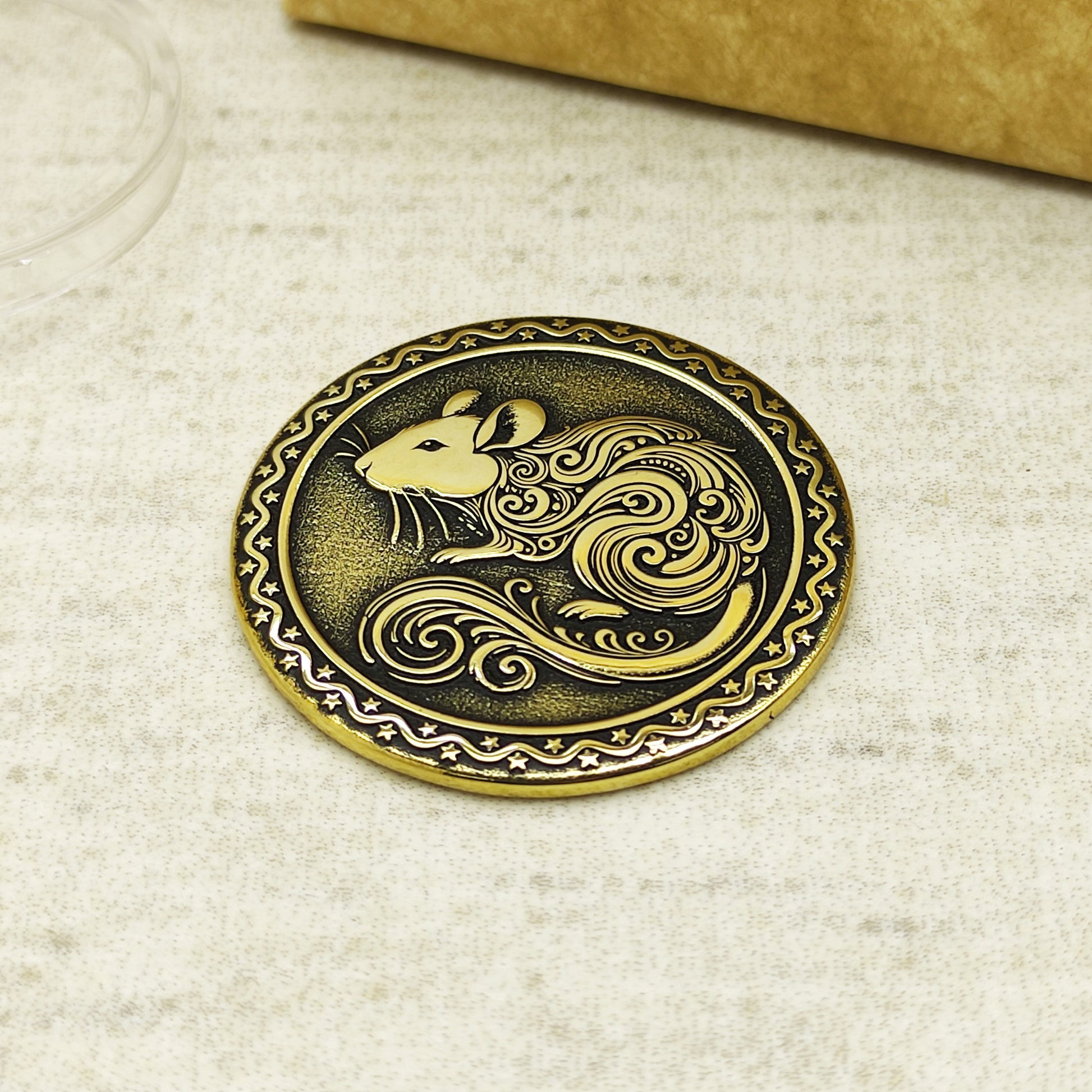 Detailed view of the brass Rat zodiac coin with 3D-style floral patterns, showcasing the 32mm diameter and professional deep laser etching.