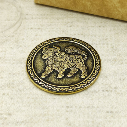 Detailed view of the brass Ox zodiac coin with 3D-style floral patterns, showcasing the 32mm diameter and professional deep laser etching.