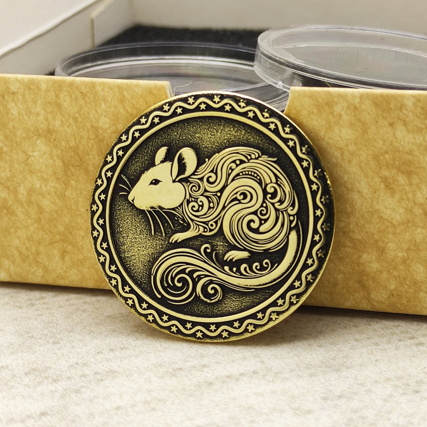 Brass Year of the Rat zodiac coin in a protective acrylic capsule and eco-friendly craft gift box, highlighting the polished brass quality.