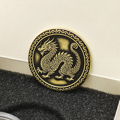 Vertical view of the personalized brass zodiac medal in a premium black insert box, showcasing the antique finish and engraved zodiac details.