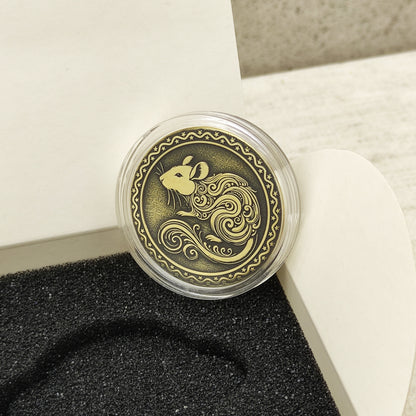 Macro photo of the brass Rat coin in a protective capsule, highlighting the intricate dark recessed patina engraving for high contrast.