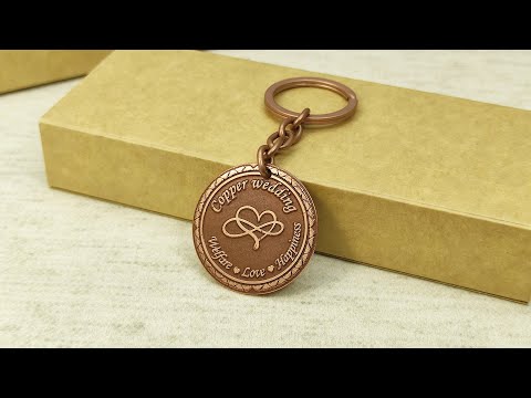 Personalized copper wedding gift keychain with "Welfare Love Happiness" laser engraving and aged finish.