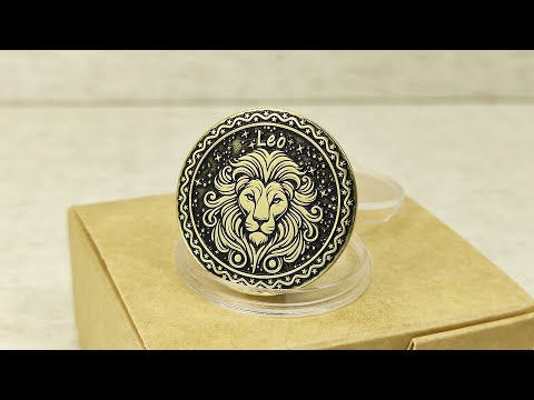 Personalized brass Leo zodiac coin placed on a craft gift box, showcasing the durable metal texture and high-contrast professional patina treatment.