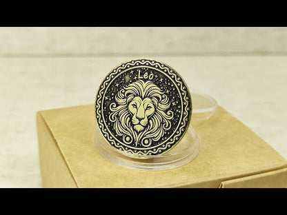 Personalized brass Leo zodiac coin placed on a craft gift box, showcasing the durable metal texture and high-contrast professional patina treatment.