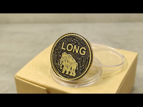 Custom engraved brass mammoth coin in protective acrylic capsule for decision making and everyday carry.
